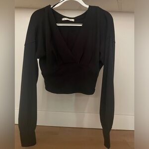 Free people cropped v neck long sleeve thermal top. Size small. Black. NWT.